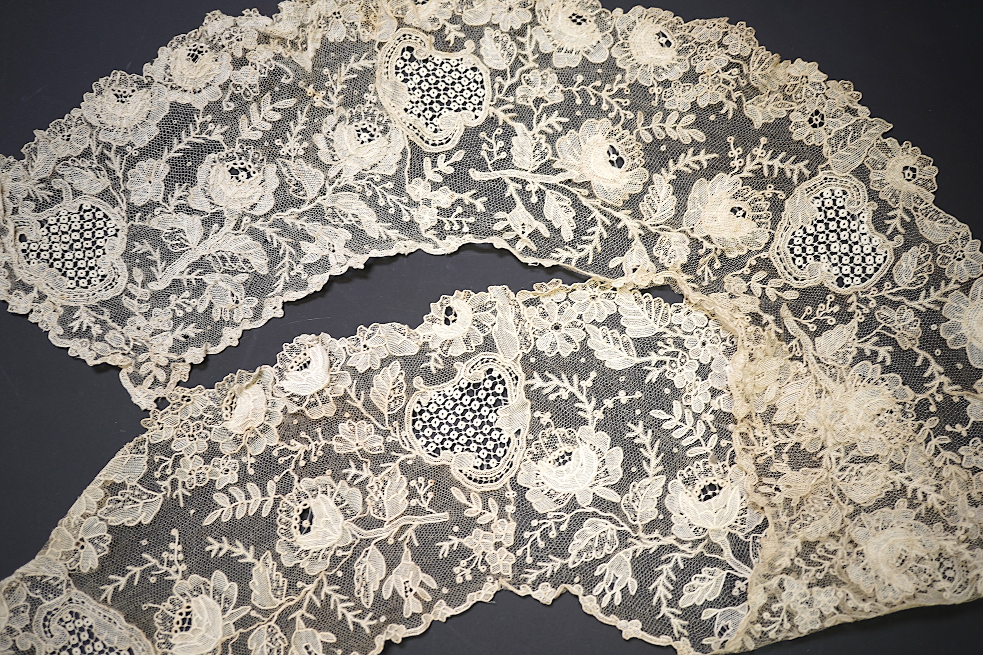 A 19th century Brussels Point de Gaz needle lace collar, lappet and wedding hankie, possibly part of a trousseau. The collar having thirty four needle lace raised flower heads within the design. The collar 100cm long x 1